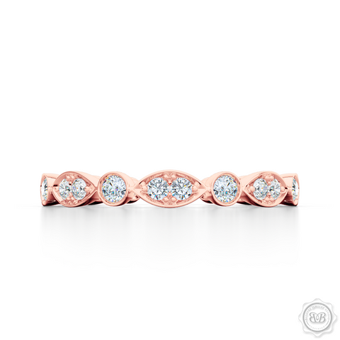 A delicate, eternity diamond wedding ring, handcrafted in Romantic Rose Gold. A brilliant array of premium quality round brilliant diamonds, set in round and marquise bezel pods. Free Shipping for All USA Orders. 30-Day Returns | BASHERT JEWELRY | Boca Raton, Florida