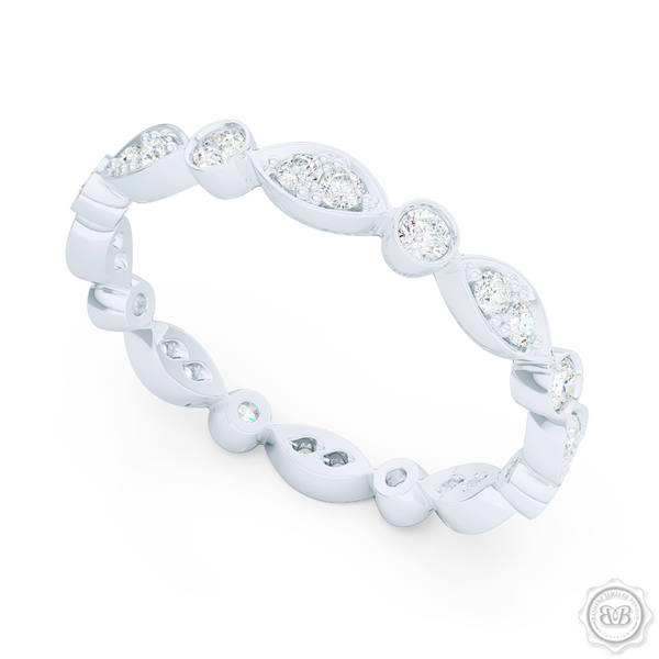 A delicate, eternity diamond wedding ring, handcrafted in White Gold or Platinum. A brilliant array of premium quality round brilliant diamonds, set in round and marquise bezel pods. Free Shipping for All USA Orders. 30-Day Returns | BASHERT JEWELRY | Boca Raton, Florida