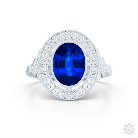 Floating Oval Halo Engagement Ring. Vintage inspired lines, handcrafted in Precious Platinum or White  Gold. Oval Royal Blue Sapphire. Halo and shoulders finished in classic french milgrain, bringing a refine art-deco silhouette to this design.  Free Shipping on All USA Orders. 30-Day Returns | BASHERT JEWELRY | Boca Raton, Florida