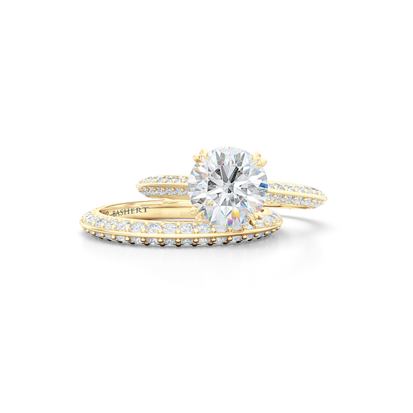 A classic Knife-edge Solitaire Engagement Ring with a recessed hidden diamond halo. Hand fabricated in Classic Yellow Gold. 100%  recycled, sustainable, precious metals.  Round Brilliant Forever One Moissanite by Charles & Colvard.  Free Shipping on All USA Orders. 15 Days Returns | BASHERT JEWELRY | Boca Raton, Florida