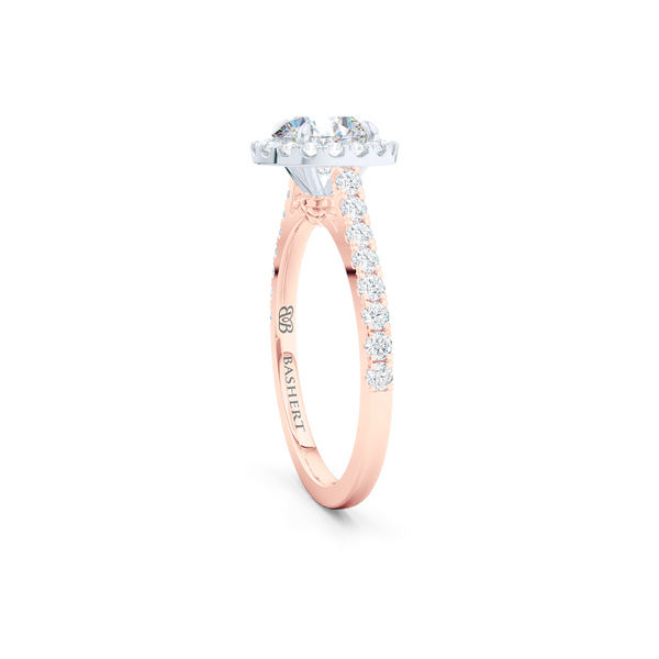 Classic micro-pavé round Halo Engagement Ring. Hand-fabricated in solid, sustainable Rose Gold and Precious Platinum crown. GIA certified Round Brilliant Diamond. Free Shipping USA. 15 Day Returns | BASHERT JEWELRY | Boca Raton, Florida