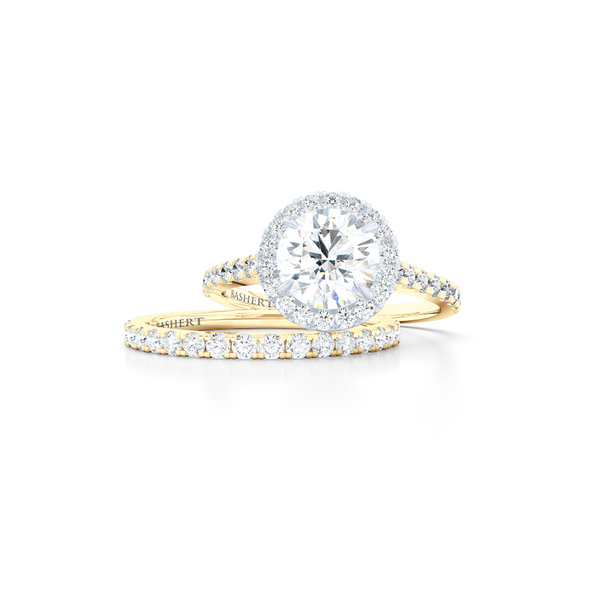 Classic micro-pavé round Halo Engagement Ring. Hand-fabricated in solid, sustainable Yellow Gold and Precious Platinum crown. GIA certified Round Brilliant Diamond. Free Shipping USA. 15 Day Returns | BASHERT JEWELRY | Boca Raton, Florida