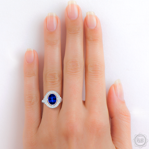 A Vintage Inspired  Floating Halo Engagement Ring. Handcrafted in Platinum or White  Gold and Oval Royal Blue Sapphire. Halo and shoulders finished in classic french milgrain, bringing a refine art-deco silhouette to this design.  Free Shipping on All USA Orders. 30-Day Returns | BASHERT JEWELRY | Boca Raton, Florida