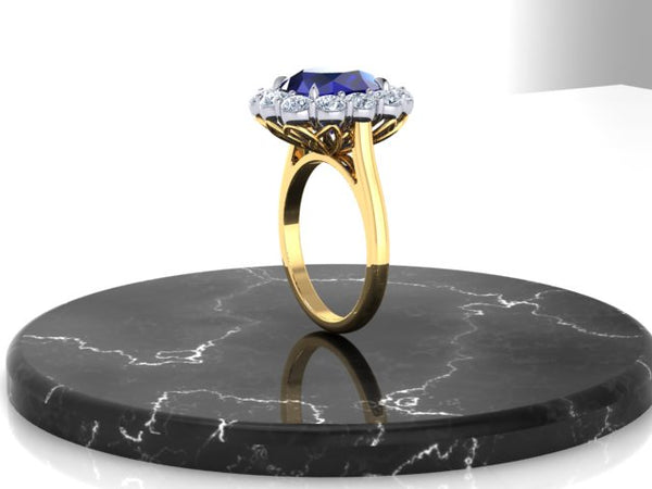 A custom-designed and fabricated heirloom halo ring, set in 18K Yellow Gold and Precious Platinum 950, showcasing a heirloom, cushion-cut Blue Sapphire* and a classic halo crown adorned with round brilliant diamonds.
