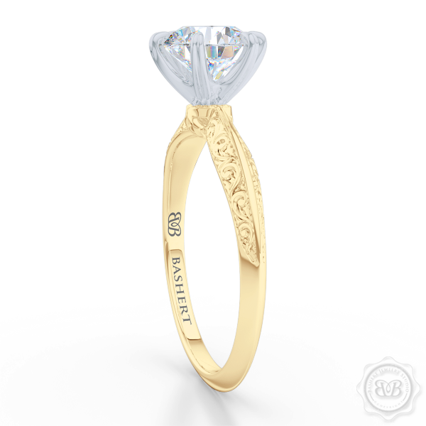 Classic knife-edge, Six-Prong Round Solitaire Engagement Ring. Crafted in Classic Yellow Gold. Elegantly hand-engraved shoulders. FOREVER ONE Round Brilliant Moissanite. Free Shipping USA. 30-Day Returns | BASHERT JEWELRY | Boca Raton, Florida