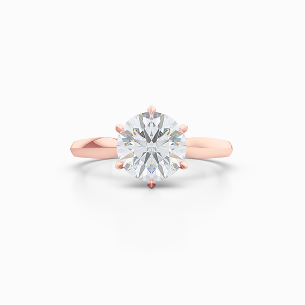 Elegant six-prong Solitaire Engagement Ring. Hand-fabricated in sustainable, solid Romantic Rose Gold and Charles & Colvard Forever One, Round Brilliant Moissanite.  Free Shipping for All USA Orders. 15-Day Returns | BASHERT JEWELRY | Boca Raton, Florida