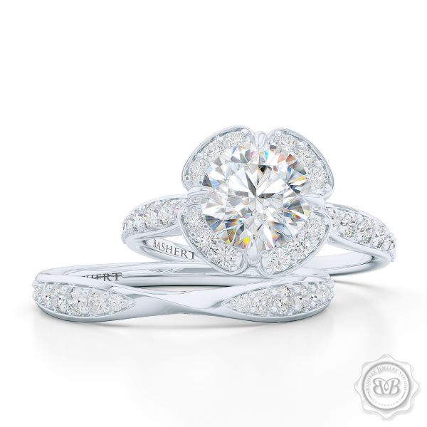 Exquisite round East-West Halo engagement ring. Crafted in White Gold and Platinum. Charles & Colvard Round Brilliant Forever One Moissanite.  Elegant bead-set Diamond encrusted shoulders. Free Shipping USA. 30-Day Returns | BASHERT JEWELRY | Boca Raton, Florida.