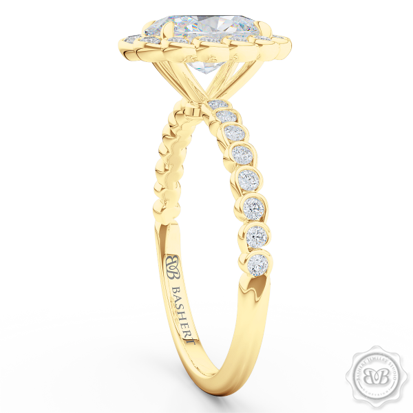 Luscious Oval Cut FOREVER ONE Moissanite Halo Engagement Ring, Crafted in Classic Yellow Gold. Stunning Halo Crown of Bezel-Set Diamonds Encrusted in Elegant Ocean Swirls. Free Shipping USA. 30-Day Returns | BASHERT JEWELRY | Boca Raton, Florida
