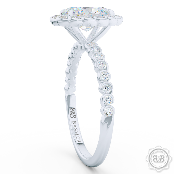 Luscious Oval Cut FOREVER ONE Moissanite Halo Engagement Ring, Crafted in White Gold or Platinum. Stunning Halo Crown of Bezel-Set Diamonds Encrusted in Elegant Ocean Swirls. Free Shipping USA. 30-Day Returns | BASHERT JEWELRY | Boca Raton, Florida