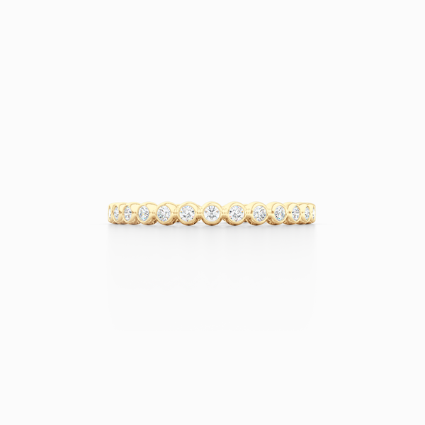 Delicate, bezel-set pots diamond eternity wedding band. Hand-fabricated in solid, sustainable Yellow Gold and premium quality Round, Brilliant Diamonds. Free Shipping for All USA Orders. 15-Day Returns | BASHERT JEWELRY | Boca Raton, Florida