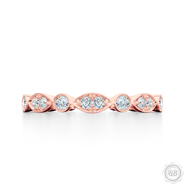 A delicate, eternity diamond wedding ring, handcrafted in Romantic Rose Gold. A brilliant array of premium quality round brilliant diamonds, set in round and marquise bezel pods. Free Shipping for All USA Orders. 30-Day Returns | BASHERT JEWELRY | Boca Raton, Florida