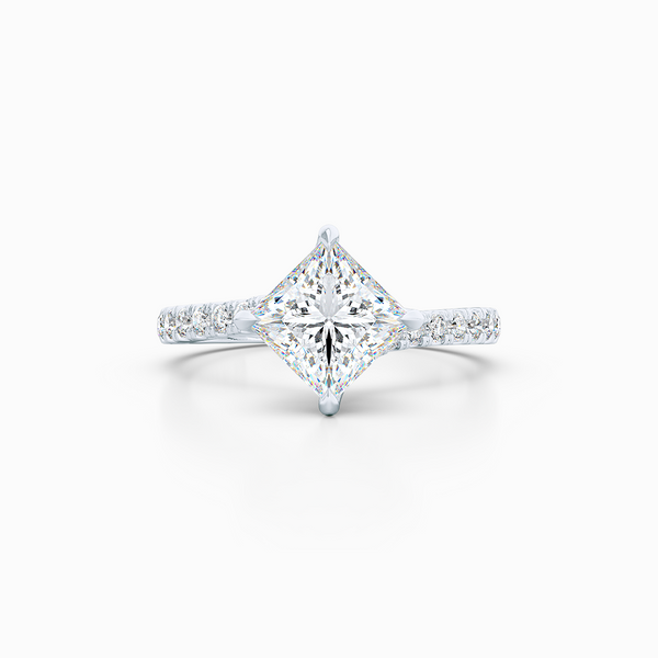East-West, four prong, Princess Solitaire. Recessed diamond halo. Diamond adorned shoulders. Hand-fabricated in Sustainable Solid White Gold. Available in Moissanite by Charles & Colvard or Lab-Grown Diamond by Diamond Foundry. | Made in Boca Raton, Florida. 15 Day Returns. Free Shipping USA. | Bashert Jewelry 
