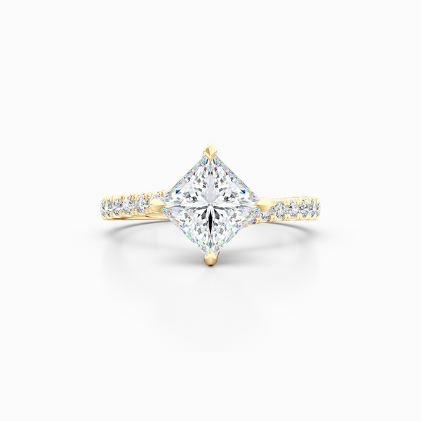 East-West, four prong, Princess Solitaire. Recessed diamond halo. Diamond adorned shoulders. Hand-fabricated in Sustainable Solid Yellow Gold. Available in Moissanite by Charles & Colvard or Lab-Grown Diamond by Diamond Foundry. | Made in Boca Raton, Florida. 15 Day Returns. Free Shipping USA. | Bashert Jewelry 