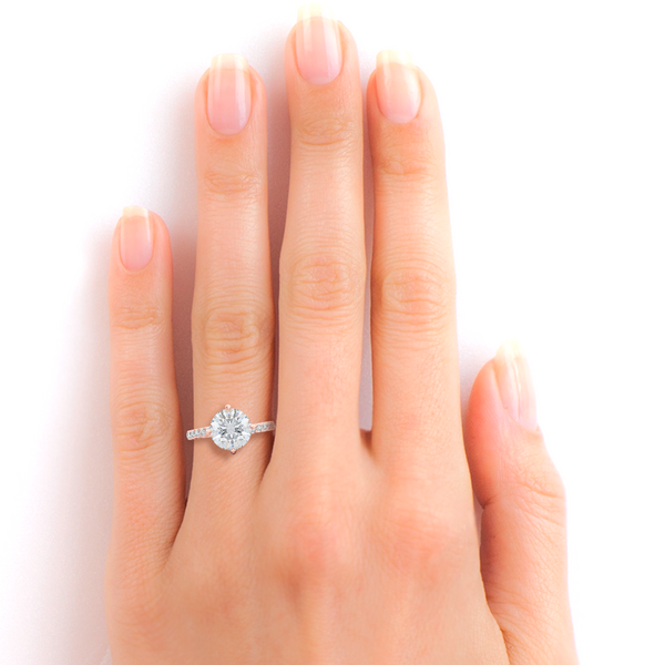 East-West, four prong, Round Solitaire. Recessed diamond halo. Diamond adorned shoulders. Hand-fabricated in Romantic Rose Gold. Available in Diamond or Lab-Grown Diamond. | Made in Boca Raton, Florida. 15 Day Returns. Free Shipping USA. | Bashert Jewelry 