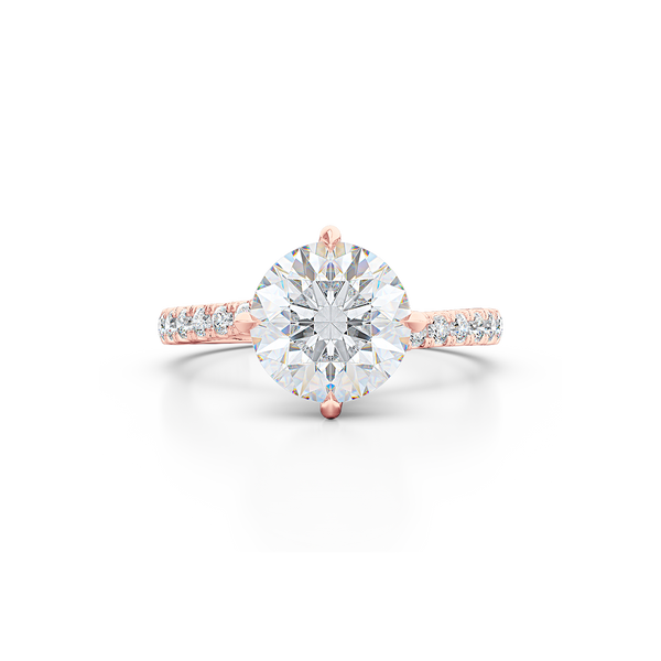 East-West, four prong, Round Solitaire. Recessed diamond halo. Diamond adorned shoulders. Hand-fabricated in Sustainable Solid Rose Gold. Available in Moissanite by Charles & Colvard or Lab-Grown Diamond by Diamond Foundry. | Made in Boca Raton, Florida. 15 Day Returns. Free Shipping USA. | Bashert Jewelry 