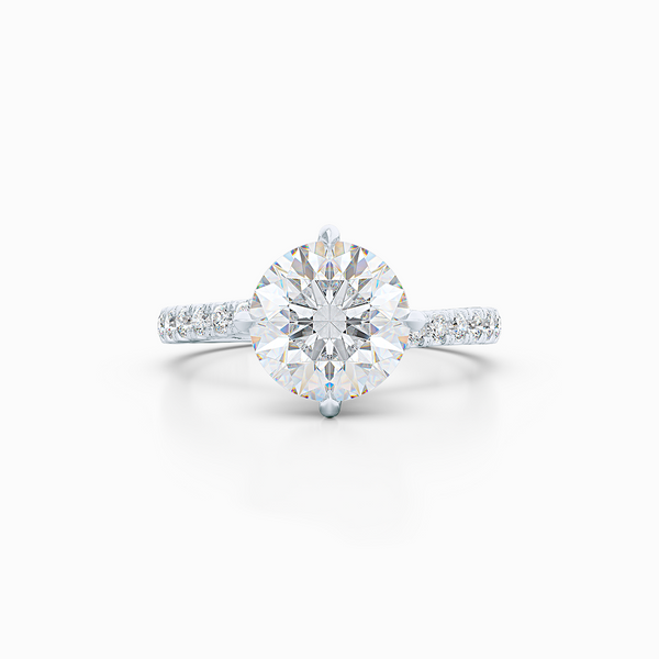 East-West, four prong, Round Solitaire. Recessed diamond halo. Diamond adorned shoulders. Hand-fabricated in Sustainable Solid White Gold. Available in Moissanite by Charles & Colvard or Lab-Grown Diamond by Diamond Foundry. | Made in Boca Raton, Florida. 15 Day Returns. Free Shipping USA. | Bashert Jewelry 