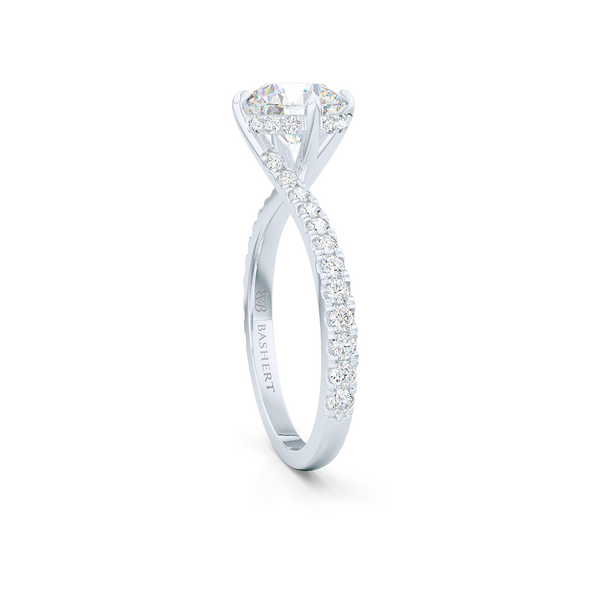 East-West, four prong, Round Solitaire. Recessed diamond halo. Diamond adorned shoulders. Hand-fabricated in Precious Platinum. Available in Diamond or Lab-Grown Diamond. | Made in Boca Raton, Florida. 15 Day Returns. Free Shipping USA. | Bashert Jewelry 