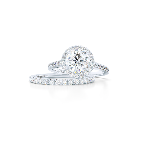 Classic micro-pavé round Halo Engagement Ring. Hand-fabricated in solid, sustainable Precious Platinum. Forever One certified Round Brilliant Moissanite by Charles and Colvard. Free Shipping USA. 15 Day Returns | BASHERT JEWELRY | Boca Raton, Florida