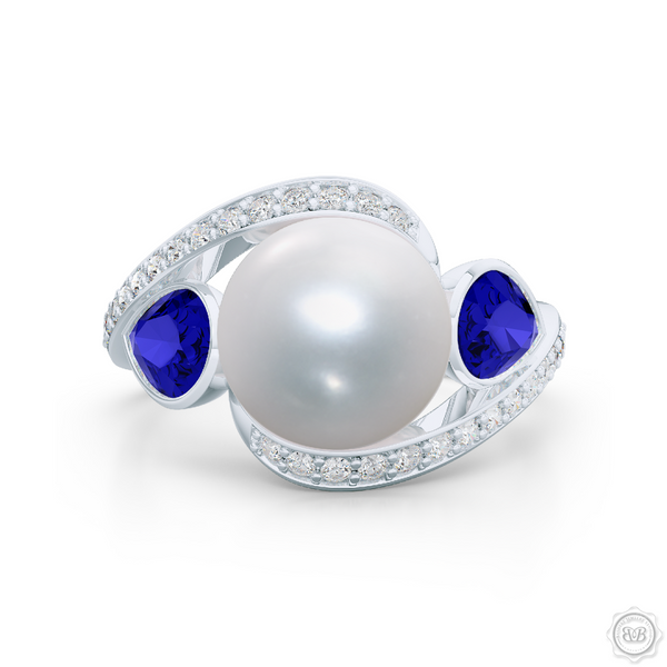 Unique Infinity Pearl Engagement Ring handcrafted in White Gold or Precious Platinum. Award-winning design featuring dazzling 10.00mm Cultured Akoya Pearl, accentuated by matching Pear Shaped Royal Blue Sapphires. The infinity intertwined shoulders of the ring are adorned with Round Brilliant diamonds, set in classic bead-set. BASHERT JEWELRY | Boca Raton, Florida