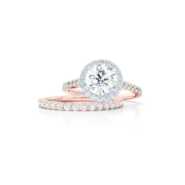 Classic micro-pavé round Halo Engagement Ring. Hand-fabricated in solid, sustainable Rose Gold and Precious Platinum crown. GIA certified Round Brilliant Diamond. Free Shipping USA. 15 Day Returns | BASHERT JEWELRY | Boca Raton, Florida
