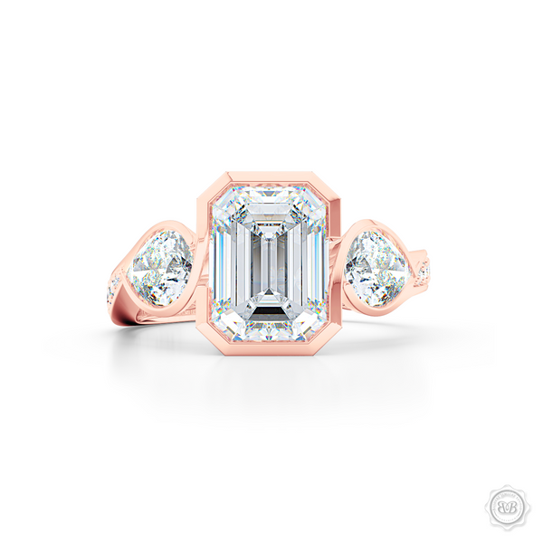 Three stone Moissanite engagement ring. Emerald Cut Forever One Moissanite by Charles & Colvard. Pear shape side stone Moissanites. Handcrafted in Romantic Rose Gold. Free Shipping on All USA Orders. 30-Day Returns | BASHERT JEWELRY | Boca Raton, Florida