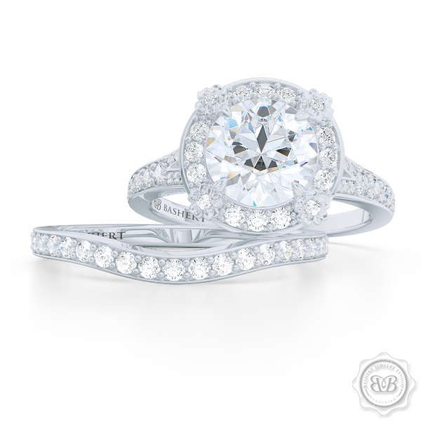Round Moissanite Halo Engagement ring, set in White Gold or Platinum. Signature floret prongs, dazzling baby-split ring shoulders.  Free Shipping USA. 30-Day Returns | BASHERT JEWELRY | Boca Raton, Florida.